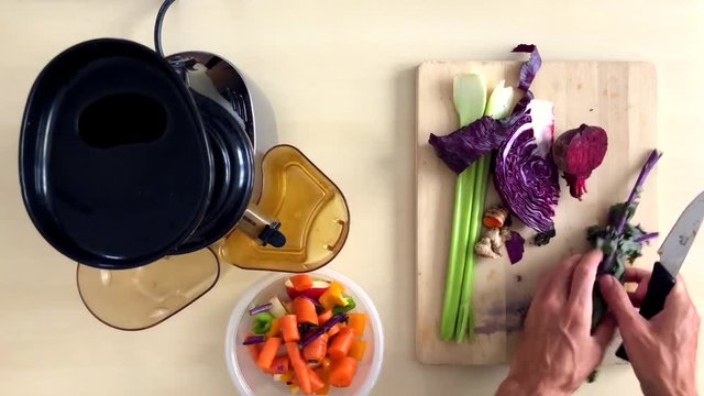 Healthy vegetable juicing time-lapse view from above