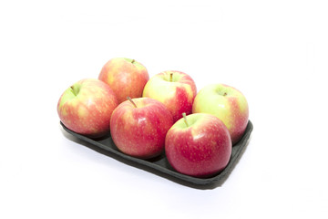 Six red and green apples on a white background