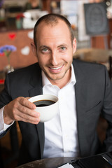 smiling man with coffee