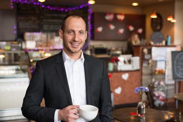 smiling buisness man with mug