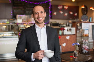 smiling buisness man with coffee