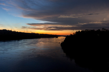 Fototapeta na wymiar The river Nile near its origin in Uganda at twilight. Shot in May 2017.