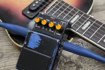 guitar fretboard and vintage effect pedals