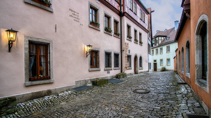 Obraz na płótnie Canvas Typical Street and historical houses in Rothenburg ob der Tauber, Bayern