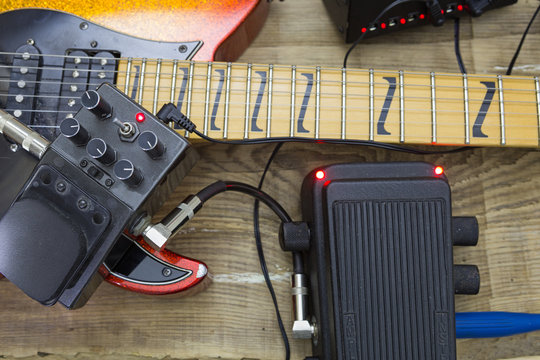 guitar fretboard and vintage effect pedals