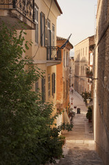 Fototapeta na wymiar Narrow street of the old part of Nafplio town in Greece