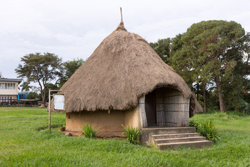 Fototapeta na wymiar Thatched roundhouses in Uganda. Shot in May 2017.