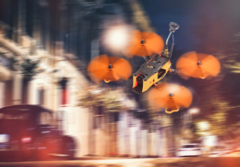 drones night flight in the city, racing FPV quadrocopter of carbon black, unmanned aerial vehicles, stylish and modern hobbies