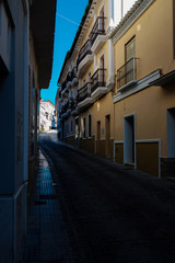Fototapeta na wymiar beautiful, picturesque street, narrow road, white facades of buildings, Spanish architecture