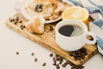 Morning coffee with croissant on the table