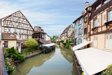 Fototapeta na wymiar Colorful traditional french houses on the side of river Lauch in Petite Venise, Colmar, France.