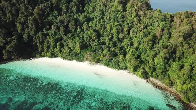 Aerial view from a drone of beautiful Nyaung Oo Phee island on sunny day in Myanmar
