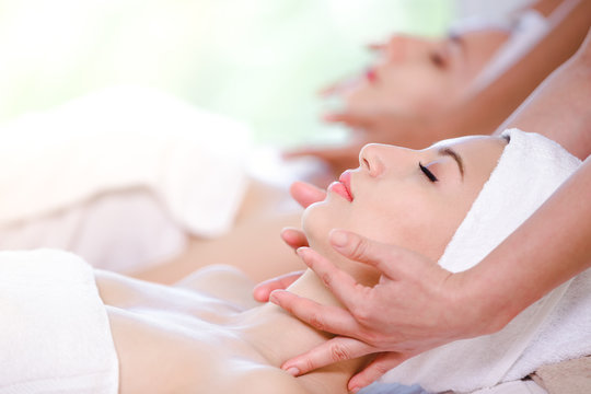 Beautiful young woman spa on face relaxing receiving massage,Spa concept