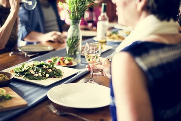 Group of diverse friends are having a dinner together