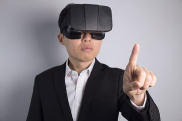 Asian man touching with vr glasses