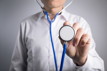 Doctor holding a stethoscope in hand