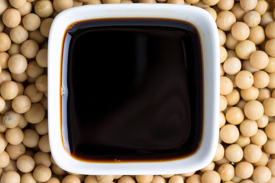 Top view of soy sauce and beans.