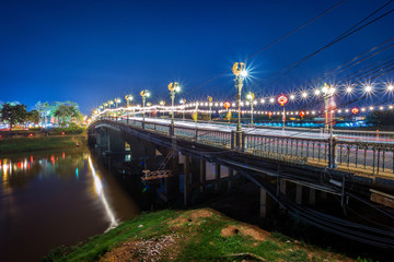 The color of the lights on the bridge (Eka Thot Sa Root Bridge) in Phitsanulok, Thailand.