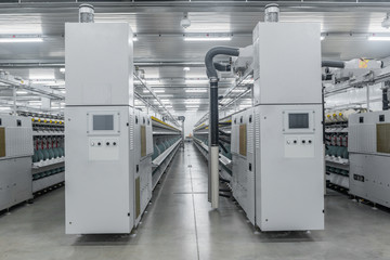 Machinery and equipment in the workshop for the production of thread, overview. interior of industrial textile factory