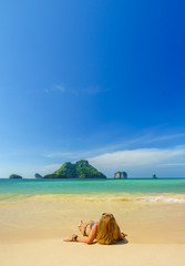 Fototapeta na wymiar woman resting at the tropical island of Poda in Thailand