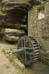 Obraz premium Small old wooden water mill.
