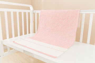 the image of parenting and baby girl crib