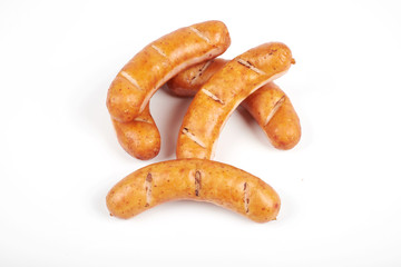 Grilled sausages isolated on a white background