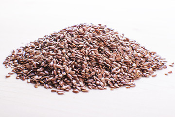 mountain of flax seeds on a light board