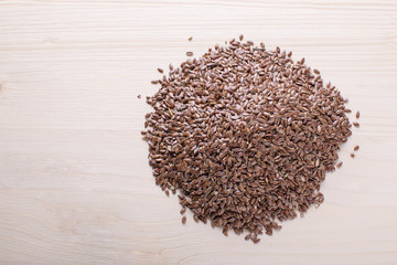 mountain of flax seeds on a light board