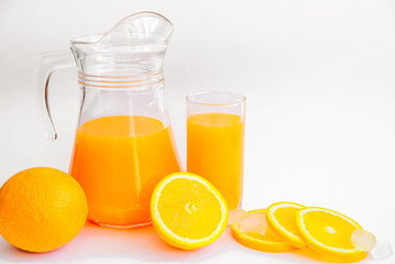 Fototapeta na wymiar Composition of freshly squeezed orange juice, whole orange and slices on a white background