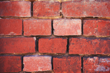 Fototapeta premium Wall from an old red brick close-up.