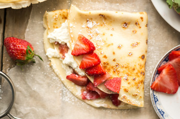 Homemade pancake with fresh ricotta cheese and strawberries