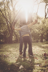 Happy mother and her daughter enjoying in park together.