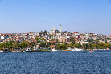 Fototapeta na wymiar Istanbul, Turkey. Beautiful view of the bay of the Golden Horn. At the top of the hill is the mosque of Sultan Selim Yavuz 