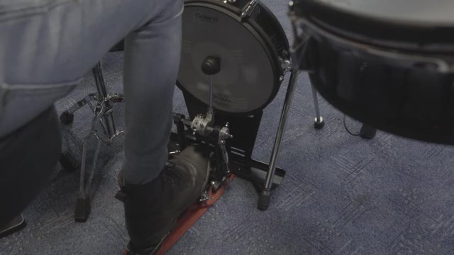  Foot playing bass drum in a music studio