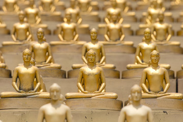 Fototapeta na wymiar Million golden Buddha figurine in Wat Phra Dhammakaya. Buddhist temple in Bangkok, Thailand