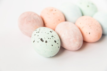 Colored Easter pastel eggs.Minimalistic style.Copy space.White background.