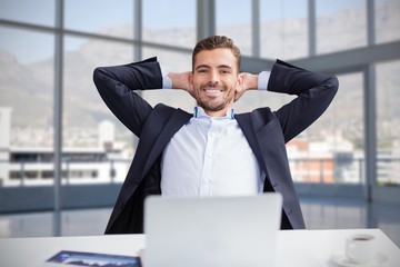 Composite image of portrait of smiling businessman with hands