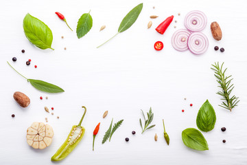 Various fresh herbs for cooking ingrediens peppermint , sweet basil ,rosemary,oregano, sage and lemon thyme on white wooden background with flat lay and copy space.