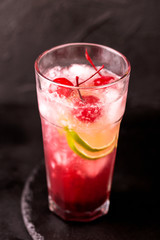 Alcoholic cocktail sour cherry gin or porch crawler. Lemonade.