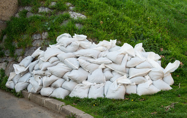 Sandbags for flood control on grass
