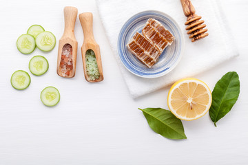 Natural herbal skin care products. Top view ingredients cucumber ,honey ,lemon and himalayan salt on table concept of the best all natural face moisturizer. Facial treatment preparation background..