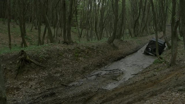 Jeep getting out of a mud puddle