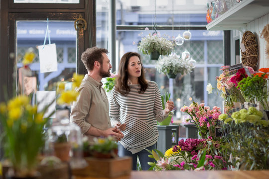Florist serving customer in a store