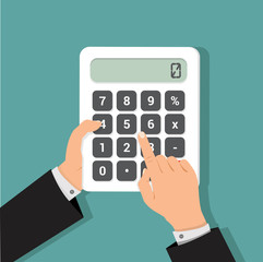 businessman hands using a calculator