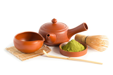Matcha Green Tea and Japanese tea set. Ceramic teapot and a steaming cup Isolated on white background