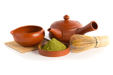 Matcha Green Tea and Japanese tea set. Ceramic teapot and a steaming cup Isolated on white background