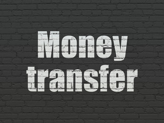 Business concept: Painted white text Money Transfer on Black Brick wall background