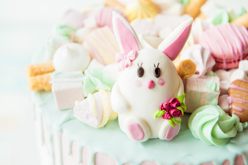 Fototapeta na wymiar Pink cake with bunny for children's birthday
