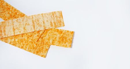 golden potato chips on a white background